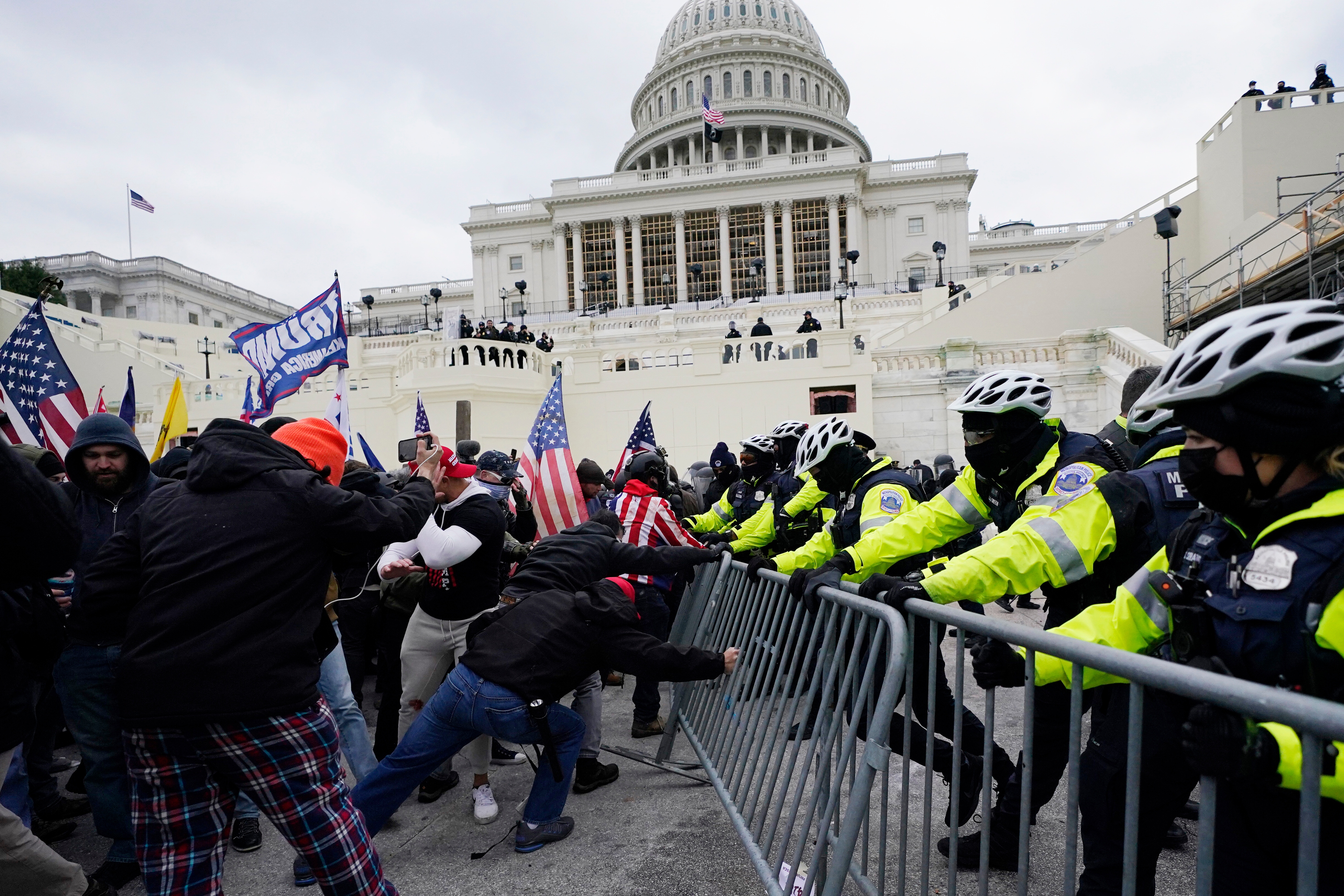 Violent insurrections loyal to President Donald Trump break through a police barrier at the Capitol in Washington on Jan. 6, 2021.